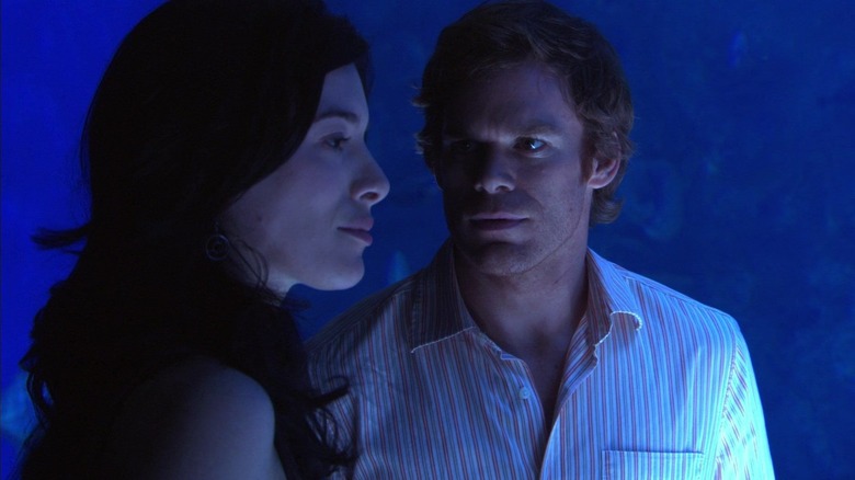 Jaime Murray and Michael C. Hall as Lila West and Dexter Morgan, together in an aquarium in Dexter.