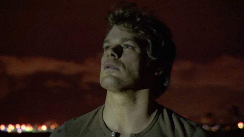 Michael C. Hall as Dexter Morgan, looking up at a blood moon in Dexter.