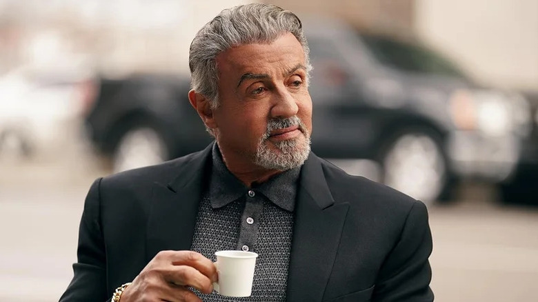 Sylvester Stallone's Dwight Manfredi holds a small coffee cup on Tulsa King