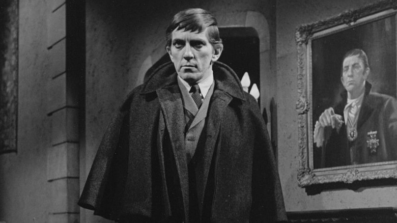 Barnabas Collins (Jonathan Frid) stands menacingly by his portrait in Dark Shadows (1962)