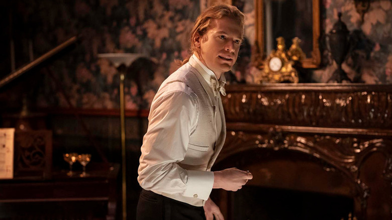 Lestat de Lioncourt (Sam Reid) looks back angrily from an ornate mantle in Interview with a Vampire