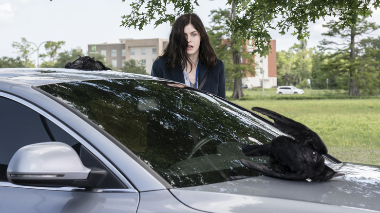 Rowan (Alexandra Daddario) looking at crows on her car in Mayfair Witches