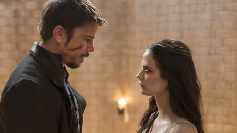 Ethan Chandler (Josh Hartnett), with a cut cheek, stares at Vanessa Ives (Eva Green) in Penny Dreadful