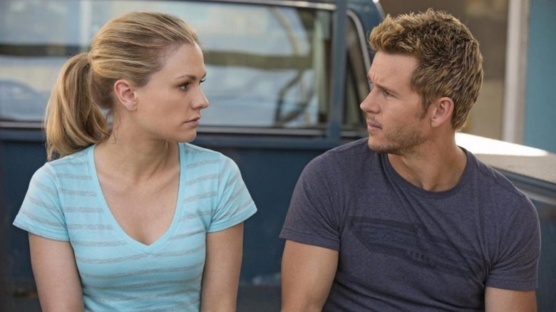 Sookie Stackhouse (Anna Paquin) stares at Jason Stackhouse (Ryan Kwanten) from the back of a pickup truck in True Blood