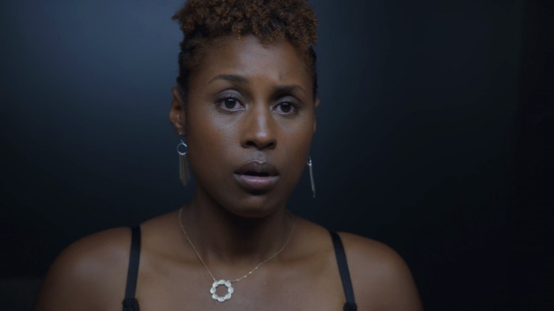 Issa looking at herself in the mirror on Insecure S1E5