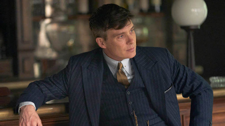 Tommy Shelby sitting on bench in Peaky Blinders