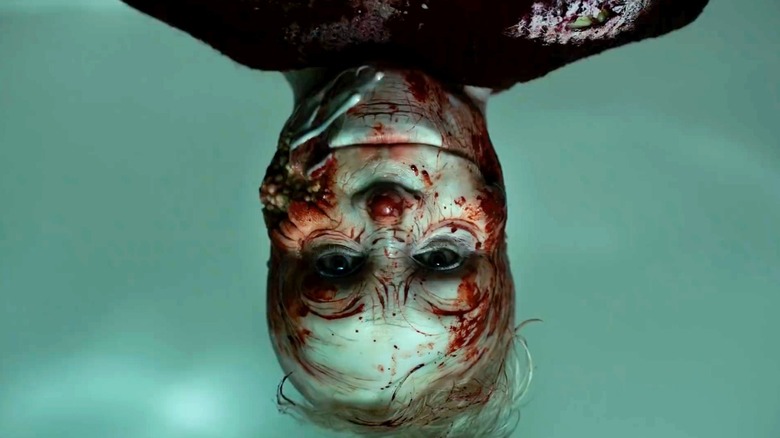 Pretzel Jack (Troy James) hangs upside down on Channel Zero