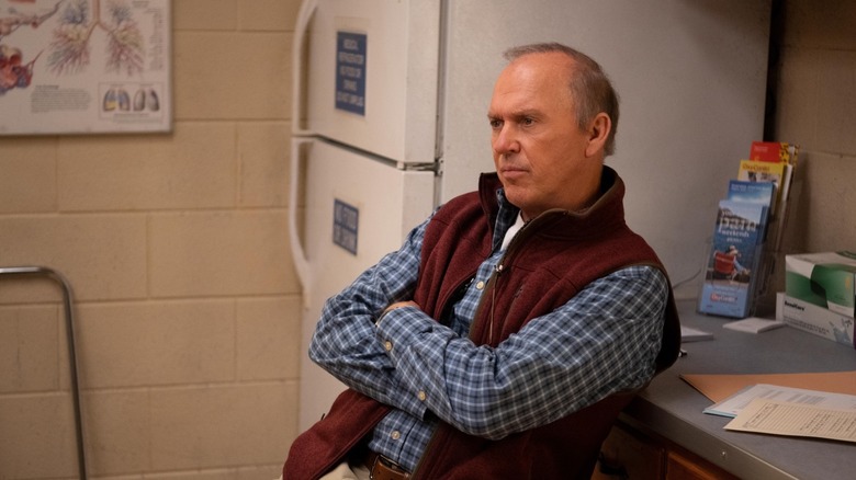 Dr. Samuel Finnix (Michael Keaton) leaning on a counter on Dopesick