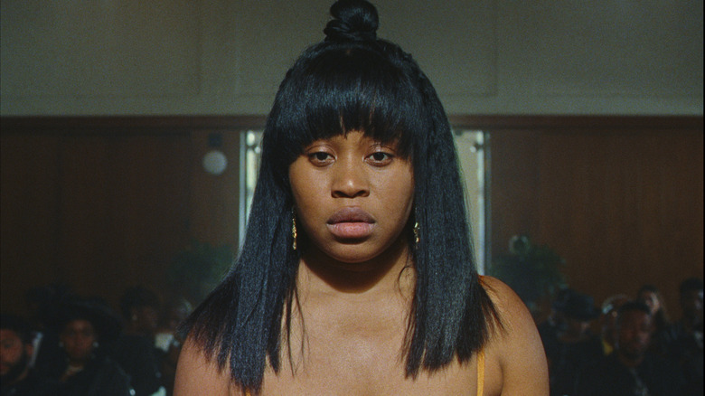 Dre (Dominique Fishback) looking stunned on Swarm