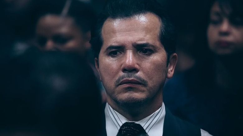 John Leguizamo as Raymond frowning in a crowd in When They See Us