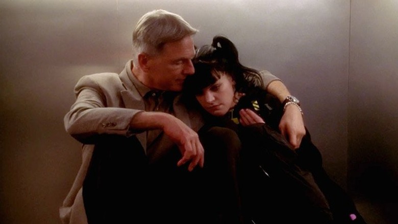 Mark Harmon's Leroy Jethro Gibbs hugging Pauley Perrette's Abby Sciuto in an elevator on NCIS