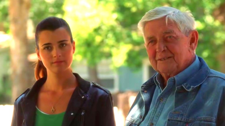 Cote de Pablo's Ziva David and Ralph Waite's Jackson Gibbs standing outdoors on NCIS