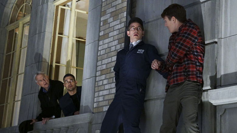 Mark Harmon's Leroy Jethro Gibbs and Wilmer Valderrama's Nicholas Torres watch as Brian Dietzen's James Palmer and Spencer Treat Clark's Ryan Smith stand on a ledge on NCIS
