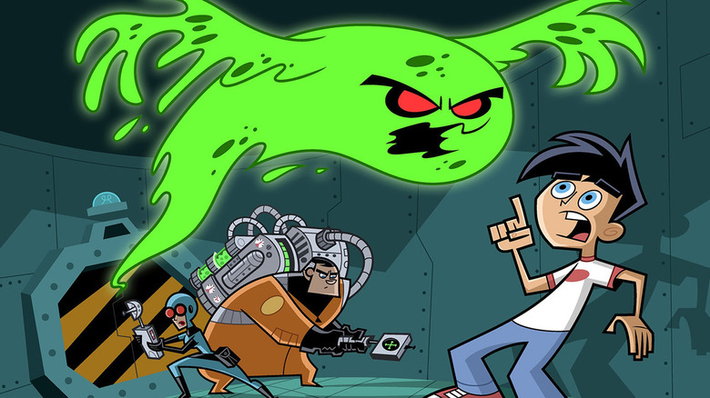 Danny Fenton recoils from a ghost as his parents prepare to act in Danny Phantom.