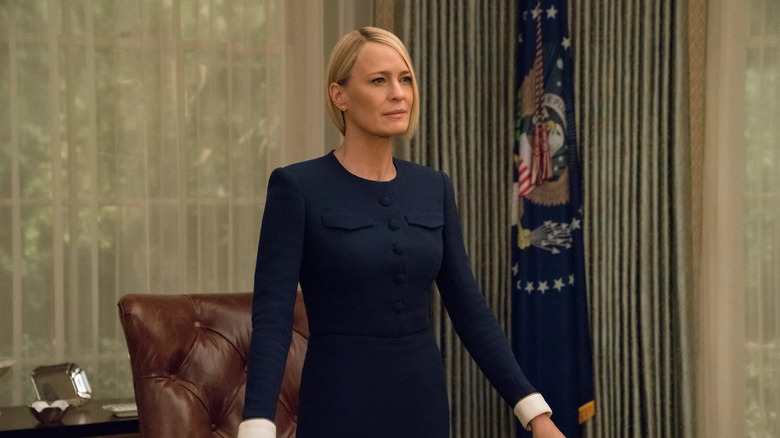 Robin Wright as Claire Underwood, standing in the Oval Office in House of Cards.