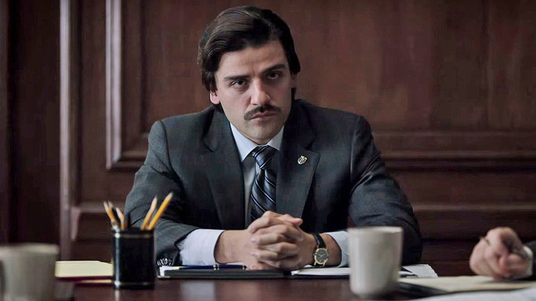 Oscar Isaac as Nick Wasicsko, sitting at a board room table in Show Me a Hero.