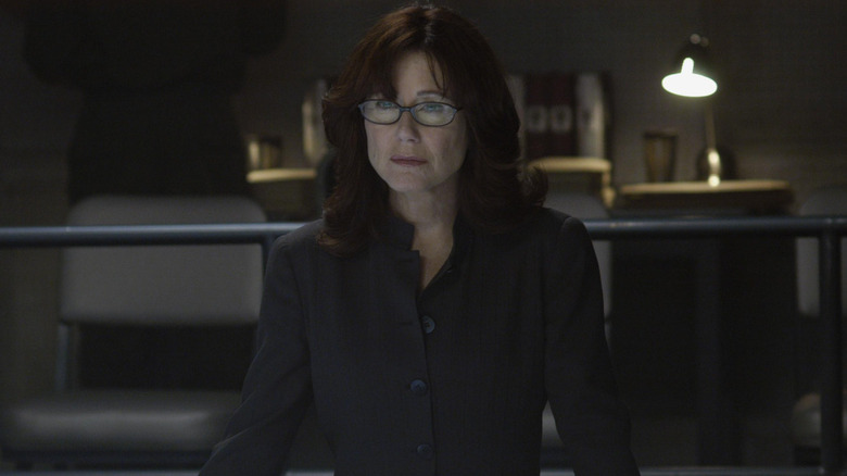Mary McDonnell as Laura Roslin wearing a black outfit in Battlestar Galactica