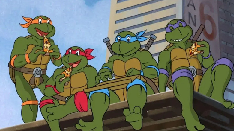 Michelangelo, Raphael, Leonardo, and Donatello enjoy pizza in Teenage Mutant Ninja Turtles