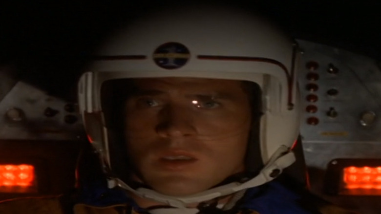 John Crichton (Ben Browder) sits in his astronaut suit in Farscape