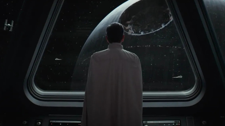 Ben Mendelsohn as Director Krennic, observing the construction of the Death Star in Andor.
