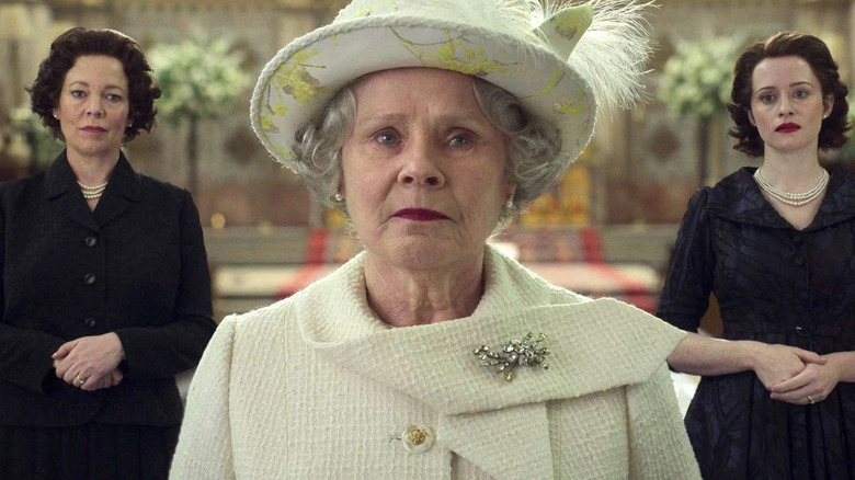 Olivia Colman, Imelda Staunton, and Claire Foy as Queen Elizabeth, standing together in The Crown.