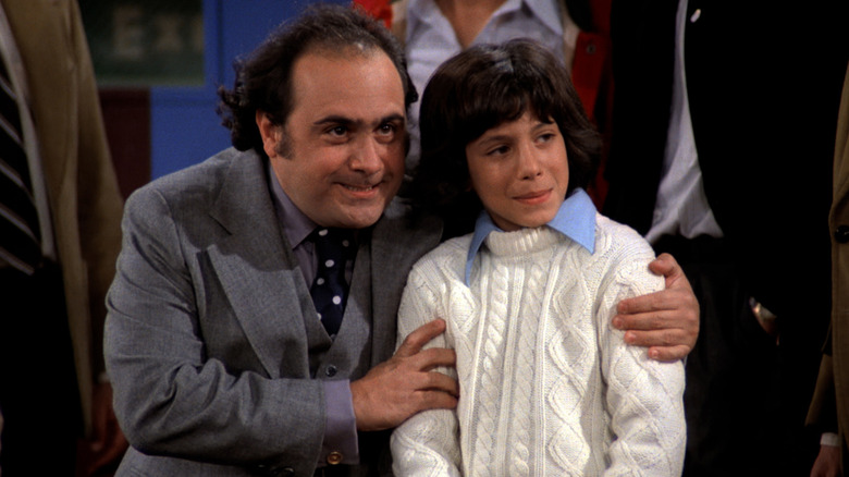 Louie (Danny DeVito) grabs Elaine's son (Michael Hershewe) in Taxi