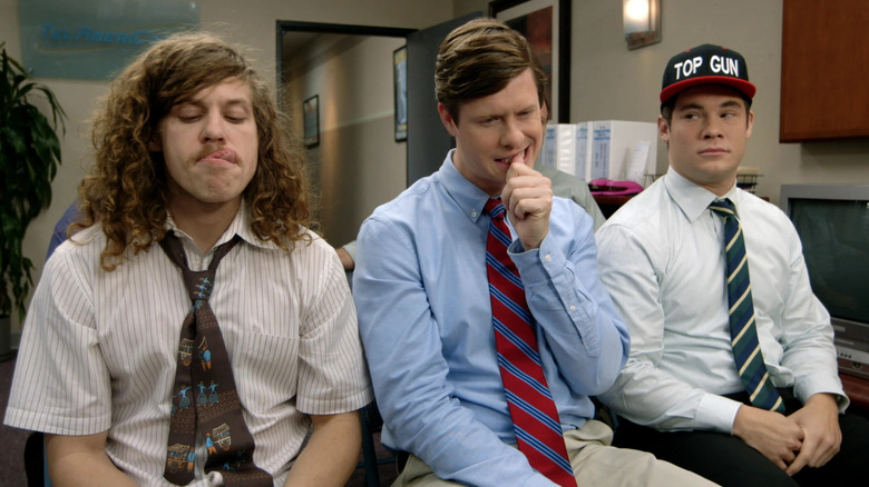 Blake (Blake Anderson), Anders (Anders Holm), and Adam (Adam DeVine) are caught in a meeting in Workaholics