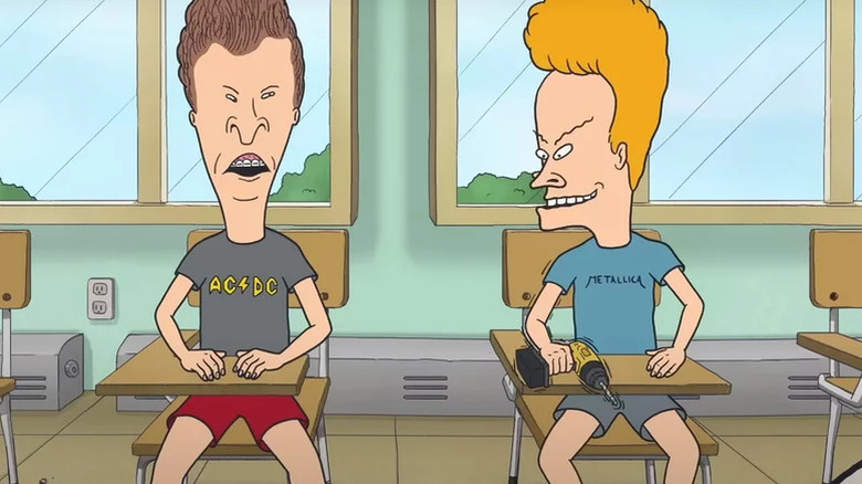 Beavis and Butt-Head sitting in classroom desks with Beavis holding a drill in Beavis and Butt-Head