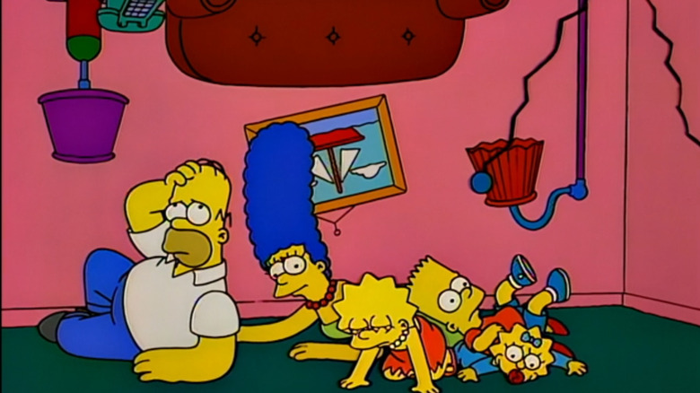 The Simpsons fall to the ground during an upside-down couch gag
