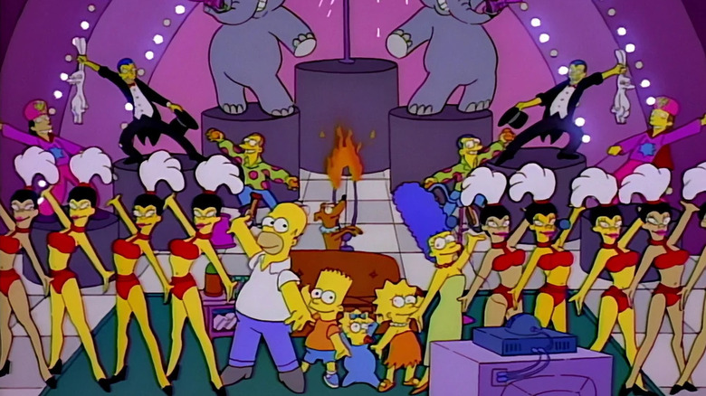 The Simpsons are accompanied by a bunch of Las Vegas entertainers in this couch gag