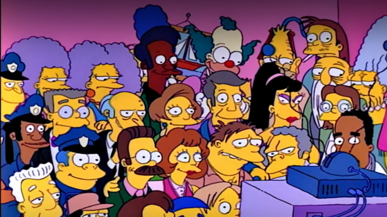 A ton of Simpsons characters fill the frame in this couch gag