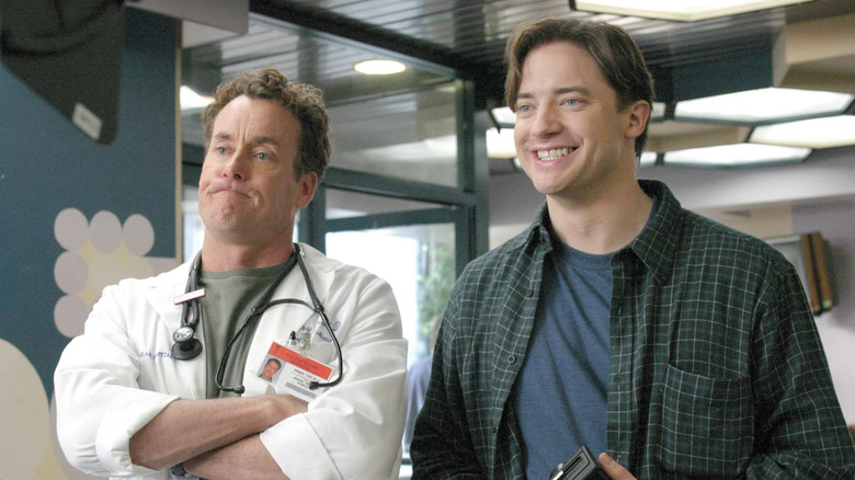 John C. McGinley as Perry Cox and Brendan Fraser as Ben Sullivan, standing together on Scrubs.