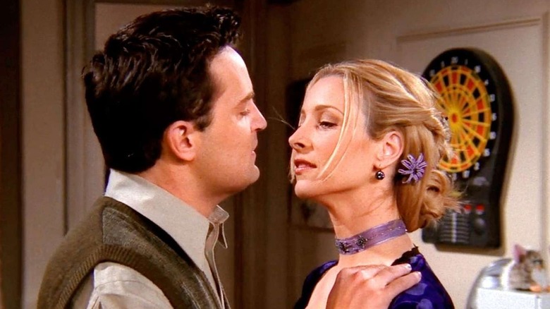 Matthew Perry as Chandler Bing and Lisa Kudrow as Phoebe Buffay, reluctantly going in for a kiss on Friends.