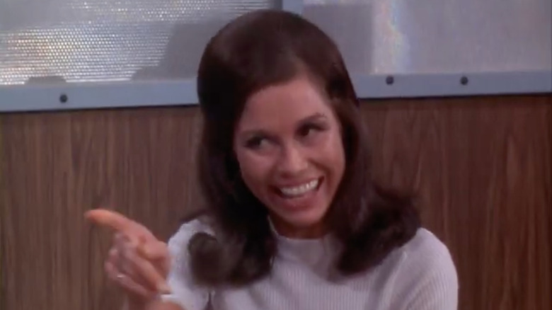 Mary Richards points her finger and laughs in "The Mary Tyler Moore Show"