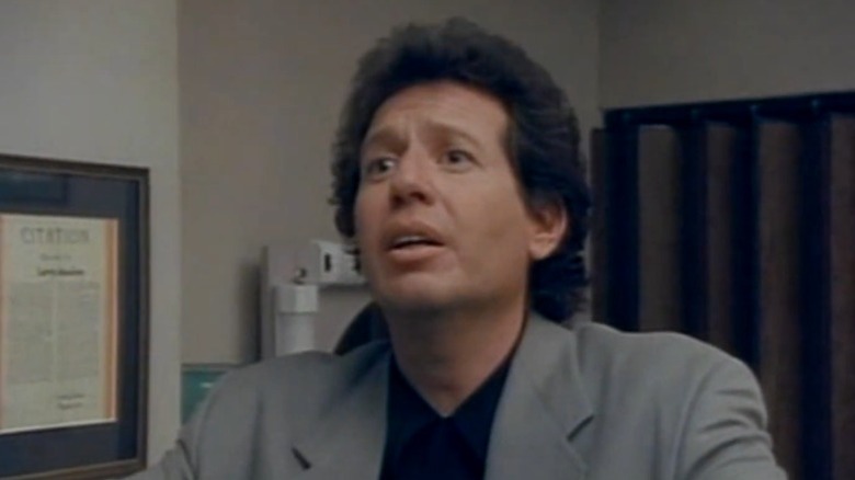 Larry Sanders speaking with an exasperated expression on The Larry Sanders Show S1E13
