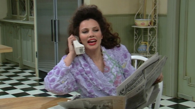 Fran Fine speaking on the phone in the kitchen on The Nanny S2E19