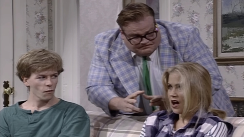 David Spade and Christina Applegate as teenagers on a couch being lectured by Chris Farley as Matt Foley on SNL