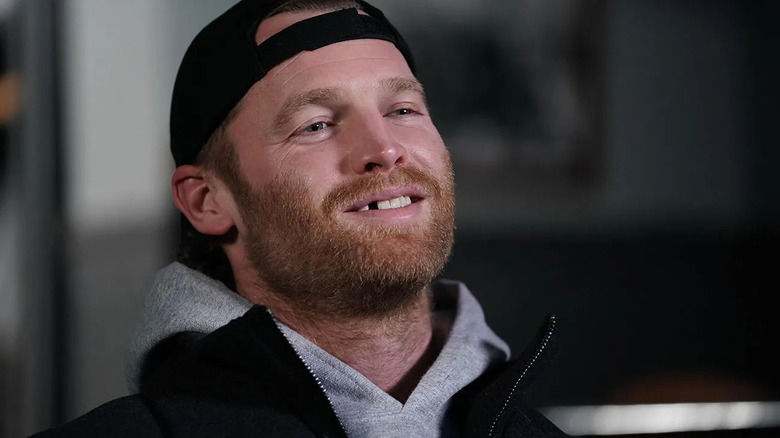 Shoresy (Jared Keeso) grins, exposing his missing tooth, in Shoresy