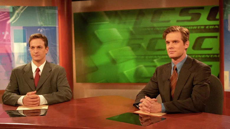 Dan Rydell (Josh Charles) and Casey McCall (Peter Krause) sit expectantly at their news desk on Sports Night