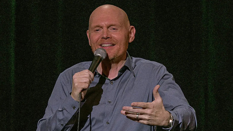 Bill Burr smiles and gestures with his hands in Bill Burr: Paper Tiger (2019)