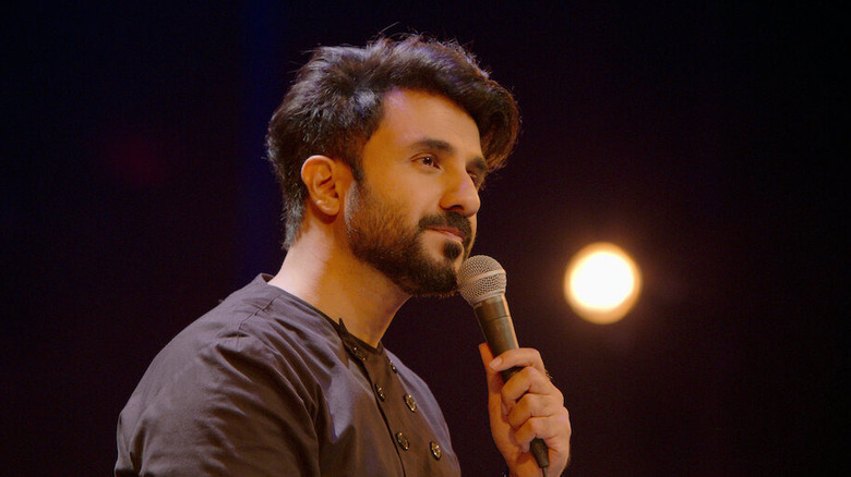 Vir Das stands matter-of-factly onstage in Vir Das: Landing (2022)