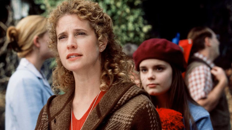 Nancy Travis as Dr. Joyce Reardon stands in front of Kimberly J. Brown as Annie Wheaton on Rose Red