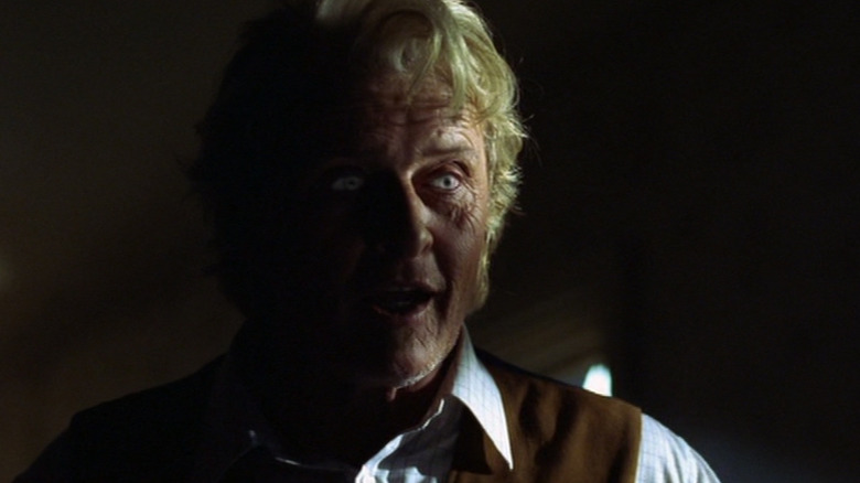 Rutger Hauer as Kurt Barlow stands in the shadows on Salem's Lot