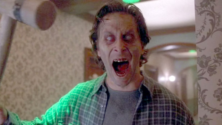 Steven Weber as Jack Torrance wielding a mallet on The Shining