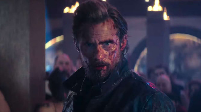 Alexander Skarsgard as Randall Flagg looks beat up on The Stand