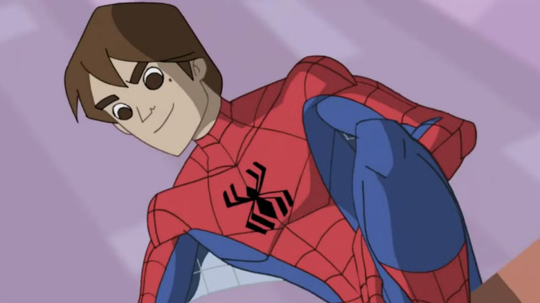 An unmasked Spider-Man crouching on a wall in The Spectacular Spider-Man