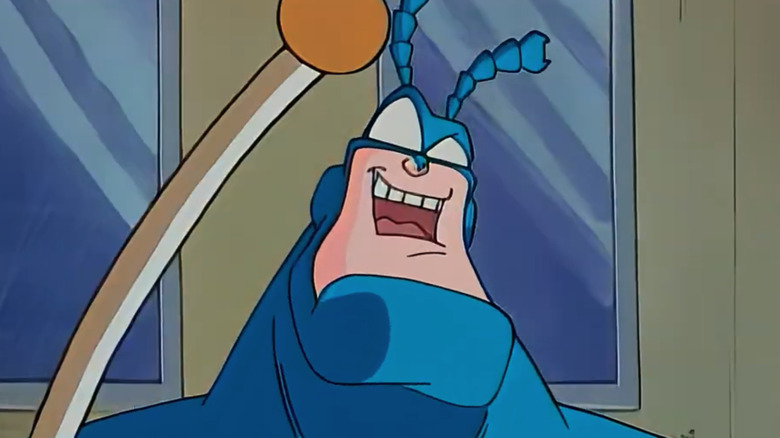 The tick holding a flag pole in The Tick