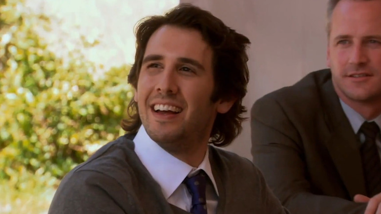 Josh Groban as Walter Jr., smiling at the garden party in "The Office."