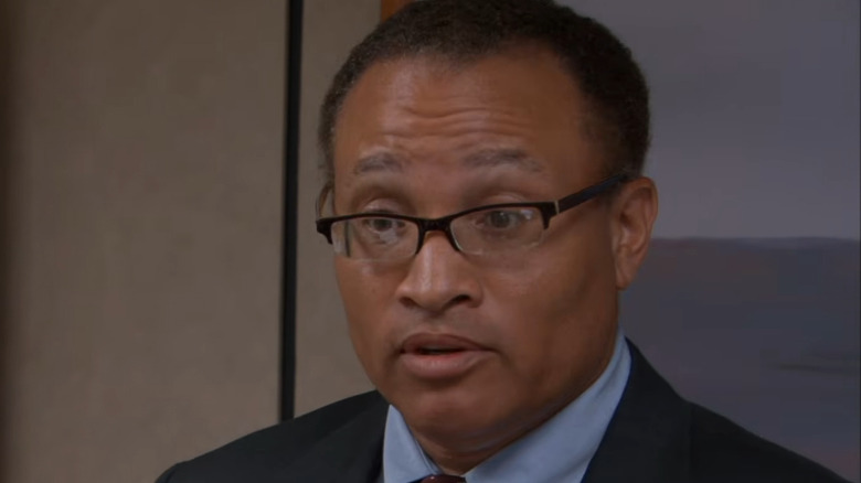 Larry Wilmore as Mr. Brown, giving a presentation in the conference room in "The Office."