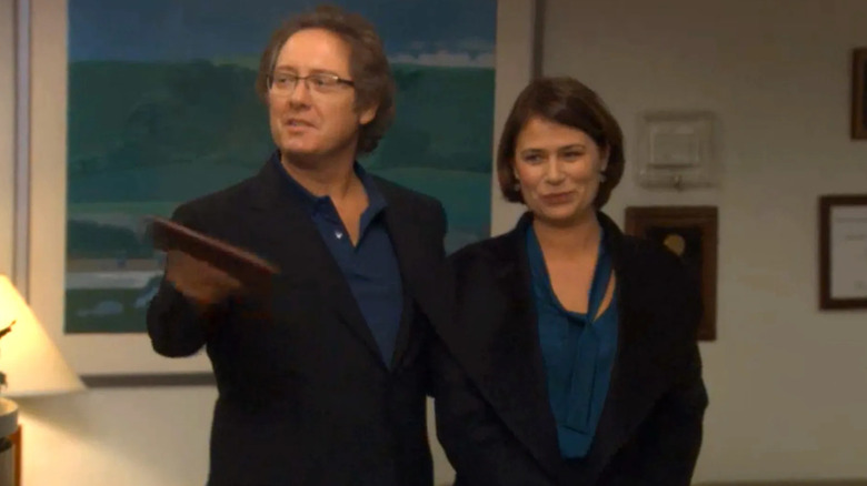 James Spader and Maura Tierney as Robert and Susan California, walking into Dunder Mifflin in "The Office."